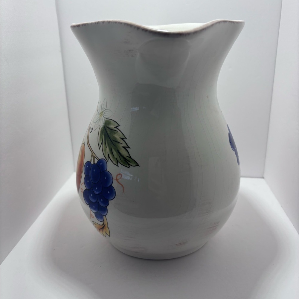 White and Orange Ceramic Art with Fruit Motifs - Picture 2 of 6